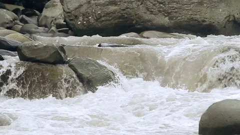 Slow motion LR pan over a breathtaking mountain river in the majestic Stock Footage 128435209