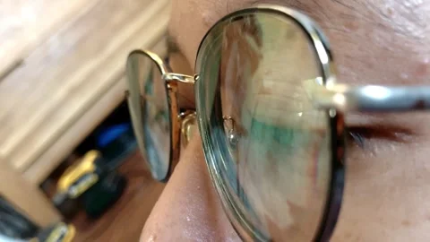 Slow Motion Macro Close Up Eye and Screen Reflection on Eyeglasses Stock-Footage 338086196