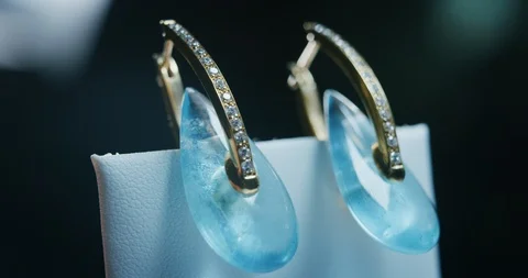 Slow motion macro close up of precious white gold jewelry earrings. Stock Footage 114937799