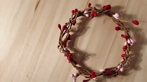 Slow motion macro close up of woven wreath with red and pink buds Stock Footage 150101066