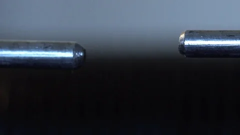 Slow motion macro of a high voltage spark gap Stock Footage 82498394