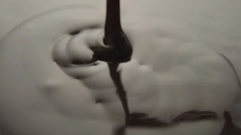 Slow Motion Macro of Liquid Chocolate Drop - Mesmerizing Tabletop Footage Stock Footage 276871232