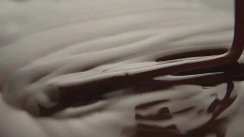 Slow Motion Macro of Liquid Chocolate Drop - Mesmerizing Tabletop Footage Stock Footage 276871242
