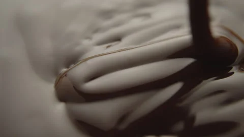 Slow Motion Macro of Liquid Chocolate Drop - Mesmerizing Tabletop Footage Stock Footage 276873319