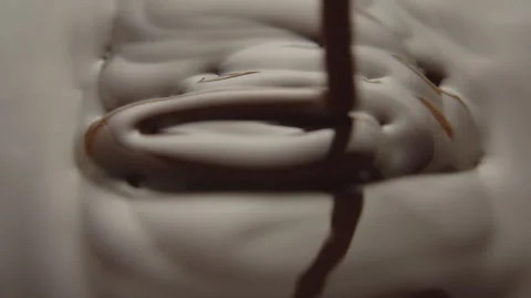 Slow Motion Macro of Liquid Chocolate Drop - Mesmerizing Tabletop Footage Stock Footage 276873427