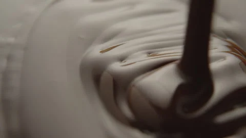 Slow Motion Macro of Liquid Chocolate Drop - Mesmerizing Tabletop Footage Stock Footage 276873861