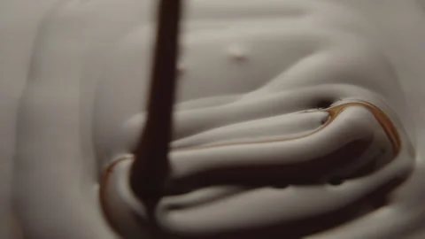Slow Motion Macro of Liquid Chocolate Drop - Mesmerizing Tabletop Footage Stock Footage 276874276