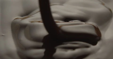 Slow Motion Macro of Liquid Chocolate Drop - Mesmerizing Tabletop Footage Stock Footage 276874890