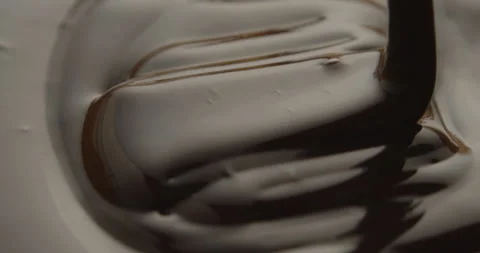 Slow Motion Macro of Liquid Chocolate Drop - Mesmerizing Tabletop Footage Stock Footage 276874912