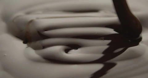 Slow Motion Macro of Liquid Chocolate Drop - Mesmerizing Tabletop Footage Video stock 276874913