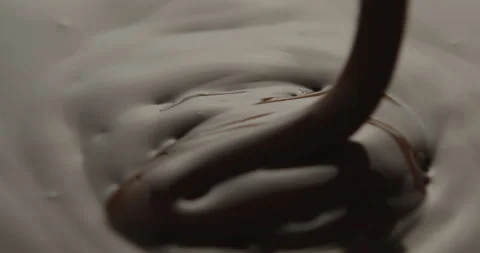 Slow Motion Macro of Liquid Chocolate Drop - Mesmerizing Tabletop Footage Stock Footage 276875099
