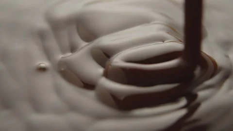 Slow Motion Macro of Liquid Chocolate Drop - Mesmerizing Tabletop Footage Stock Footage 276875350