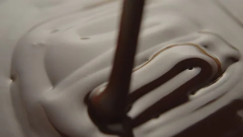 Slow Motion Macro of Liquid Chocolate Drop - Mesmerizing Tabletop Footage Stock Footage 276875379