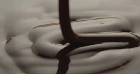 Slow Motion Macro of Liquid Chocolate Drop - Mesmerizing Tabletop Footage Stock Footage 276875436