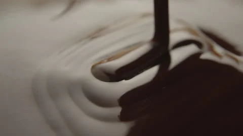 Slow Motion Macro of Liquid Chocolate Drop - Mesmerizing Tabletop Footage Stock Footage 276875940