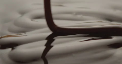 Slow Motion Macro of Liquid Chocolate Drop - Mesmerizing Tabletop Footage Video stock 276875944
