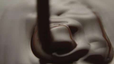 Slow Motion Macro of Liquid Chocolate Drop - Mesmerizing Tabletop Footage Stock Footage 276875985