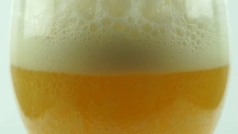 Slow motion macro. Pouring beer into a glass Stock Footage 148219986