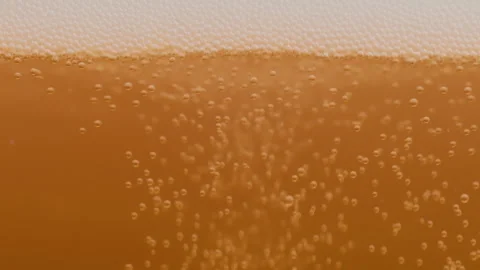 Slow motion macro shot of beer pouring. Beautiful Beer Bubbles Rising Up Stock Footage 309861892