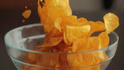 Slow Motion Macro Shot of Chips Falling Down Into Glass Bowl. Close-up Pota.. Stock Footage 290210869