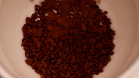Slow Motion Macro Shot Closed-up Instant Coffee Pieces Falling into Coffee Cup. Stock Footage 143155382