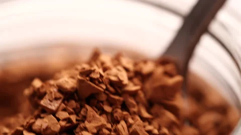 Slow Motion Macro Shot Closed-up Scooping Instant Coffee Pieces from the Bottle. Stock Footage 143155394