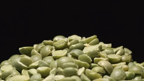 SLOW MOTION: Macro shot of falling of dried green peas on a heap Stock Footage 71451619