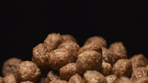 SLOW MOTION: Macro shot of falling of chocolate balls on a heap Vídeo Stock 71451747