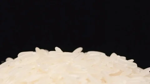SLOW MOTION: Macro shot of falling of white rice on a heap Stock Footage 71451868