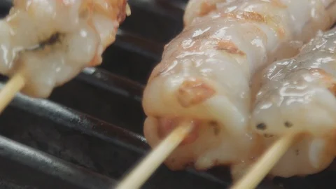 Slow-motion macro shot of a frying prawns Stock Footage 92018490