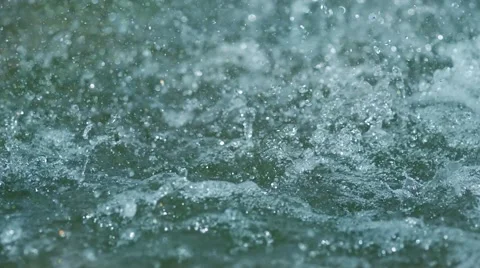 SLOW MOTION: macro shot of rain drop falling in the sea water Stock Footage 52153716