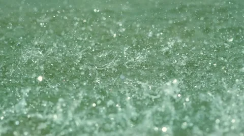 SLOW MOTION: macro shot of rain drop falling in the sea water Stock Footage 52153768