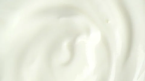 Slow motion macro shot of white yogurt, top view. Sour cream or fresh greek.. Stock Footage 268273853
