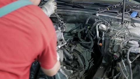 Slow motion macro of specialist is working on production of different gearing 库存影片 121280652