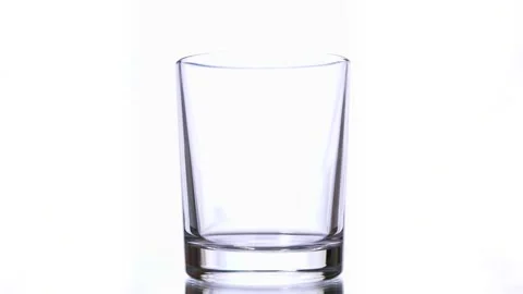 Slow motion macro still life of water poured in transparent glass Stock Footage 155078956