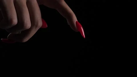 SLOW MOTION, MACRO, Tiny drop of water falls off finger. Black background Stock Footage 141202699