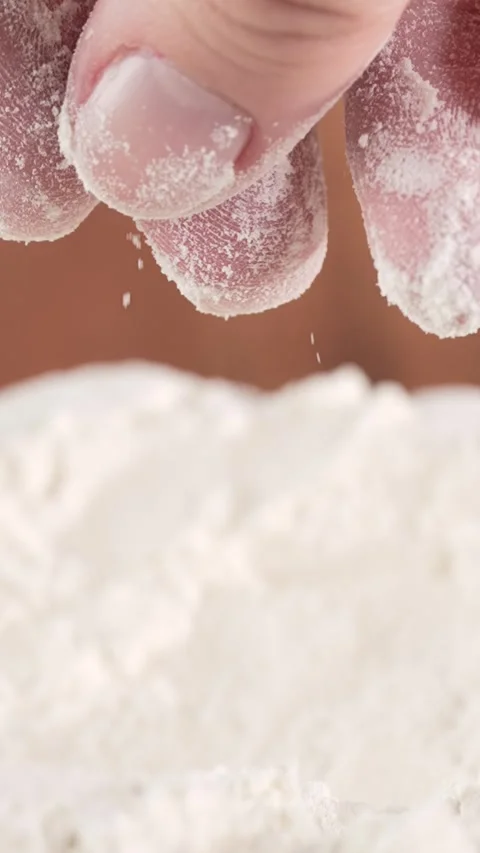 Slow-motion macro video of flour trickling from a woman's hand. The gentle .. Stock Footage 312169699