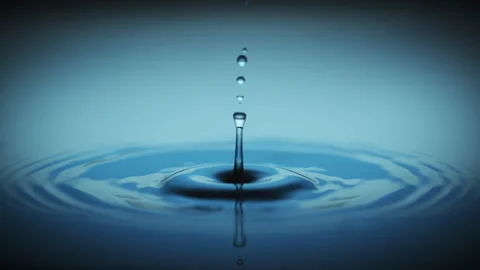 Slow motion macro water drop blue Stock Footage 158439331