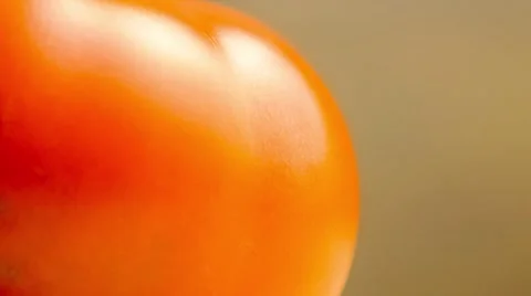 Slow motion macro of water misting onto juicy tomato and forming a wet surfac Stock Footage 62714864