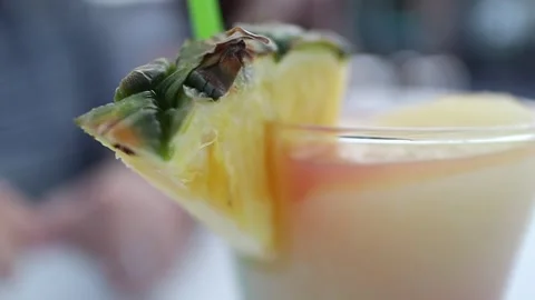 Slow motion mai tai with pineapple on a hot summer day Stock Footage 136029968