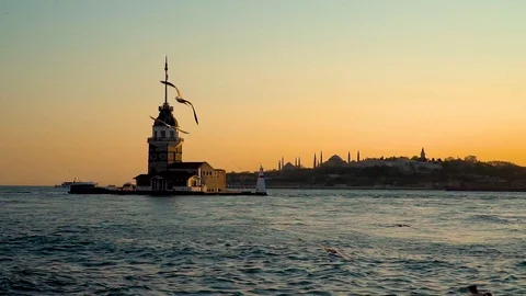 Slow motion Maiden Tower at sunset on Bosphorus in Uskudar, Istanbul, Turkey. Stock Footage 121555560