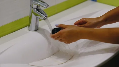 Slow motion. makeu p brush. Woman washing dirty makeup brush with soap and foam Stock Footage 116716070
