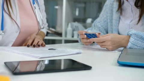 Slow motion. Male physicians hand writing rx prescription doctor in the Stock-Footage 336587873