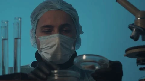 Slow motion. A man of Arab appearance Laboratory researcher examines samples in Stock Footage 233030696