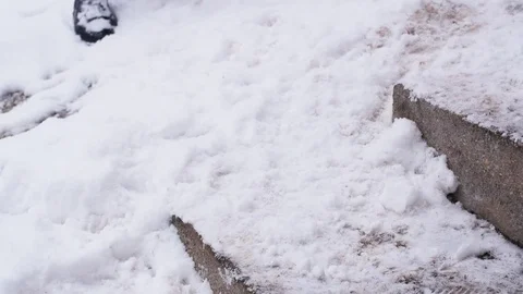 Slow Motion Of Man Clearing Snow Off Of Boots Stock Footage 85104066