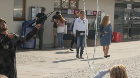Slow motion Man creating soap bubbles and children playing and enjoying a lot Stock Footage 104712430
