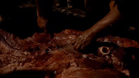 Slow Motion of man cuts skin pork carcass in slaughter at street night farm-Dan Stock Footage 103387856