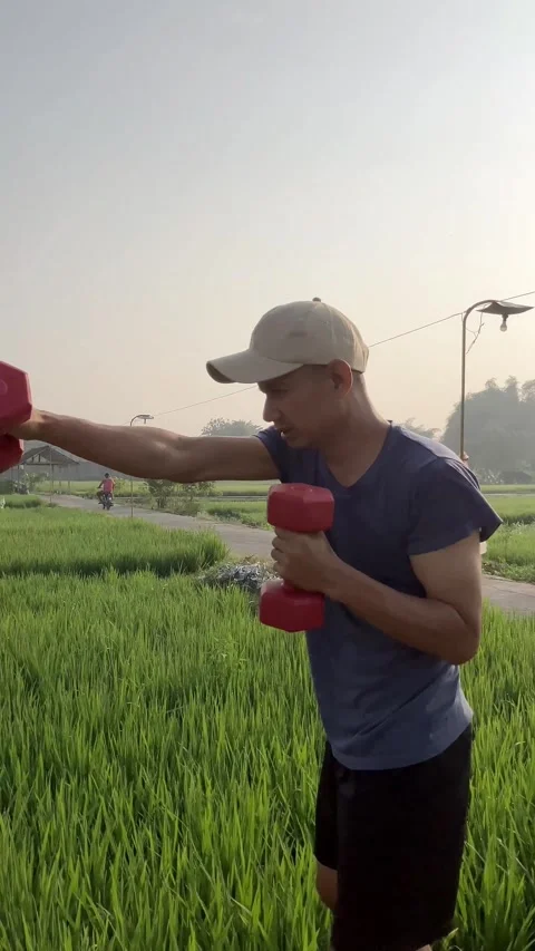 Slow Motion Of Man Doing Dumble Punch At Ricefarm Stock Footage 340978699
