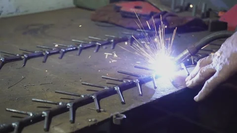 Slow motion. Man doing welding work. Welder welding a metal. Stock Footage 159744576
