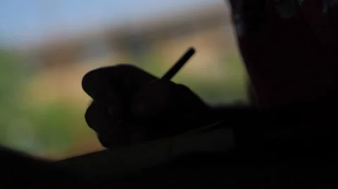 Slow motion of a man drawing in the backlight Stock Footage 51725513